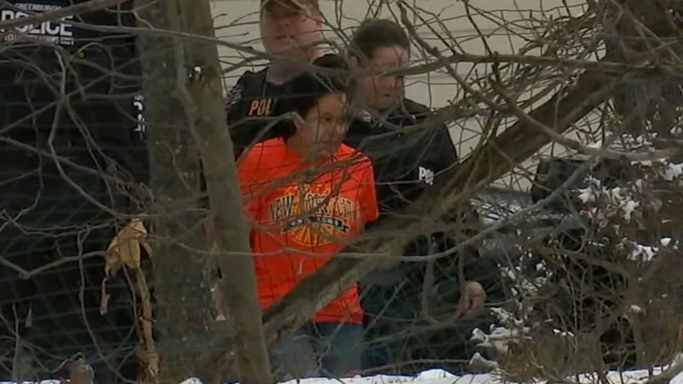 PHOTO: A woman is led in handcuffs from an alleged fentanyl mill in a suburban home in Ardsley, New York