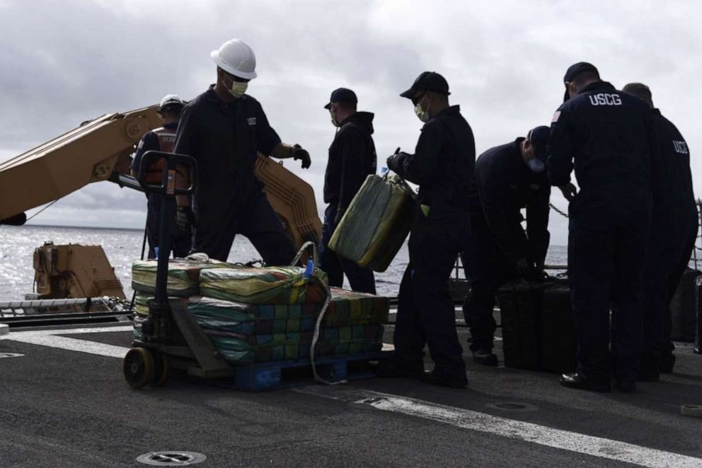 PHOTO: Coast Guard Cutter Bertholf (WMSL 750) crew members palletize bales of contraband on the cutter’s flight deck following an at-sea interdiction of a low-profile go-fast vessel during Bertholf's patrol of the Eastern Pacific Ocean, Nov. 4, 2019.