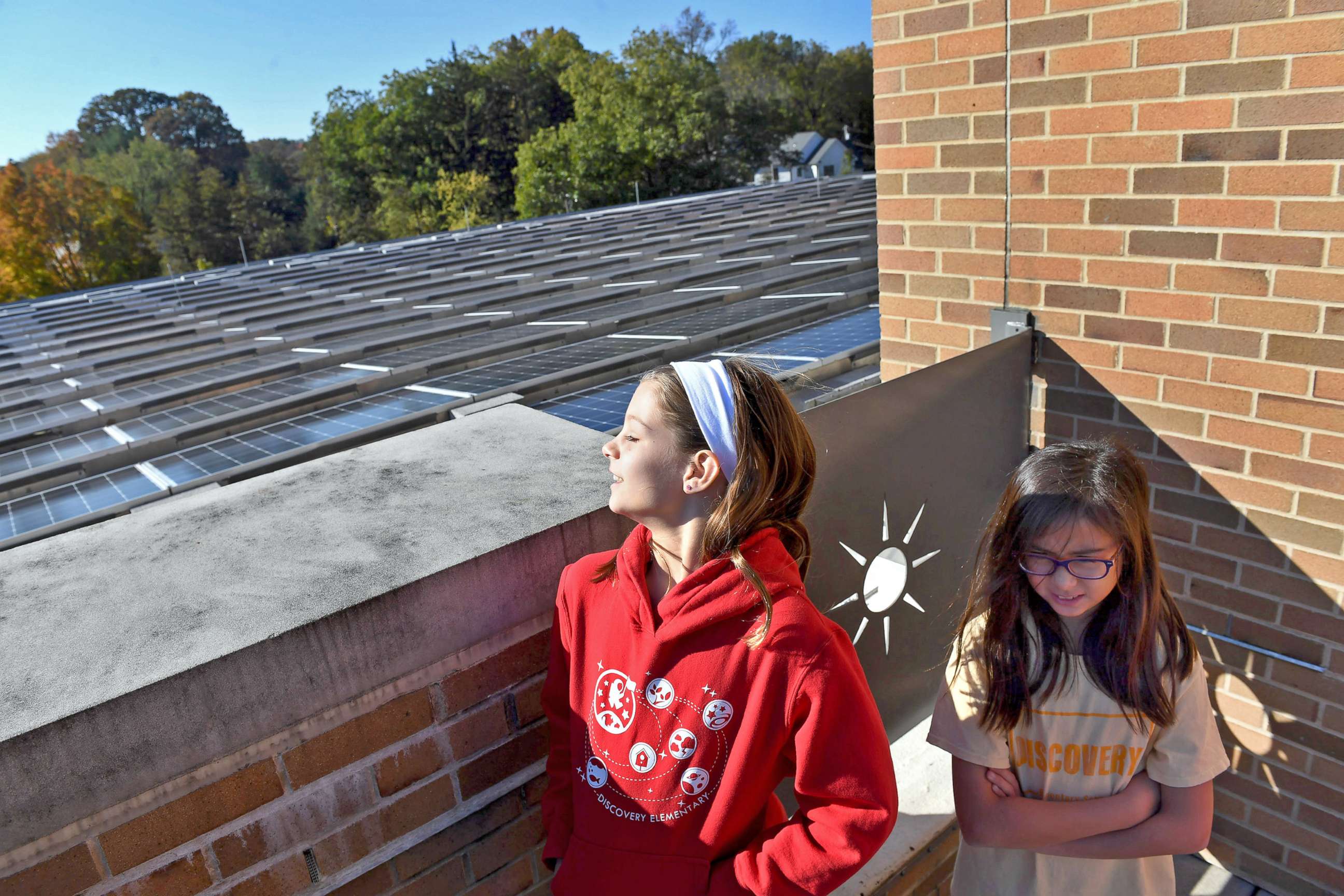 PHOTO: Students give a tour of an area with solar panels at Discovery Elementary School on Nov. 4, 2019 in Arlington, Va. The energy efficient school teaches students about renewable energy, waste recycling and other responsible environmental approaches.