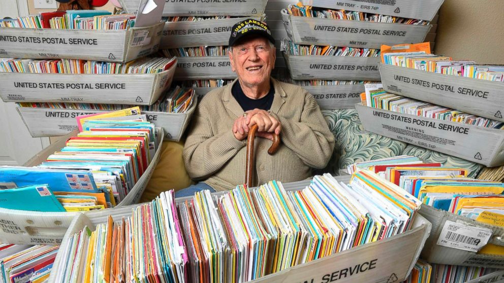 PHOTO: Duane Sherman, 96, poses at home with a small fraction of the 50,000 birthday cards he's received.