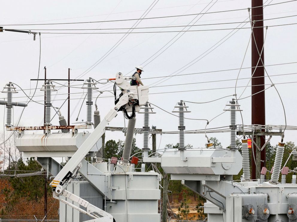 PHOTO: In Dec. 4, 2022, Duke Energy personnel work to restore power at a second crippled electrical substation after the Moore County Sheriff said that vandalism caused a mass power outage, in Carthage, N.C.