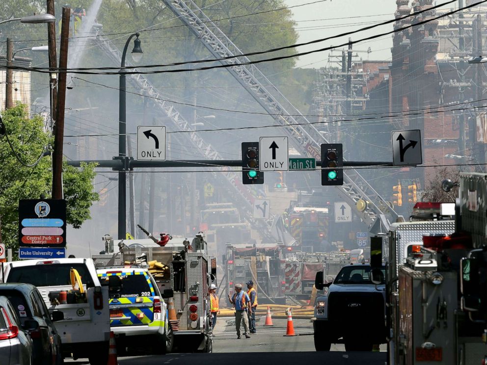 PHOTO: Firefighters and emergency personnel work the scene of an explosion and building fire in downtown Durham, N.C., April 10, 2019.