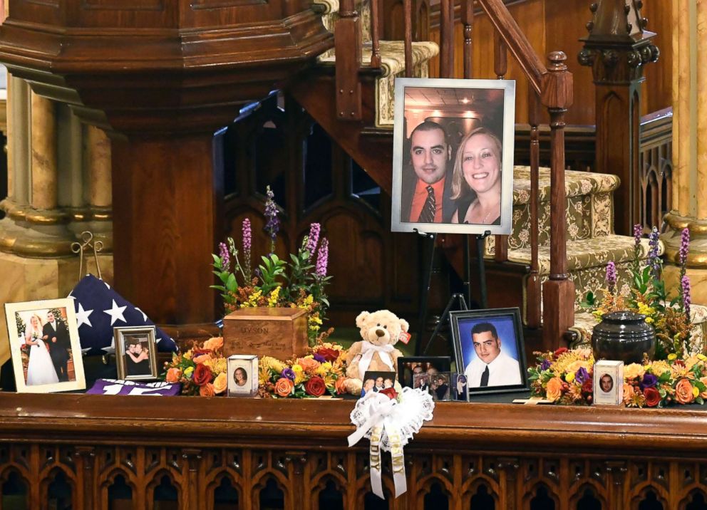 PHOTO: A unity urn with cremated ashes of Robert Joseph Dyson and Mary E. Dyson is set in place as friends and family prepare for a funeral mass at St. Stanislaus Roman Catholic Church in Amsterdam, N.Y., Oct. 13, 2018.