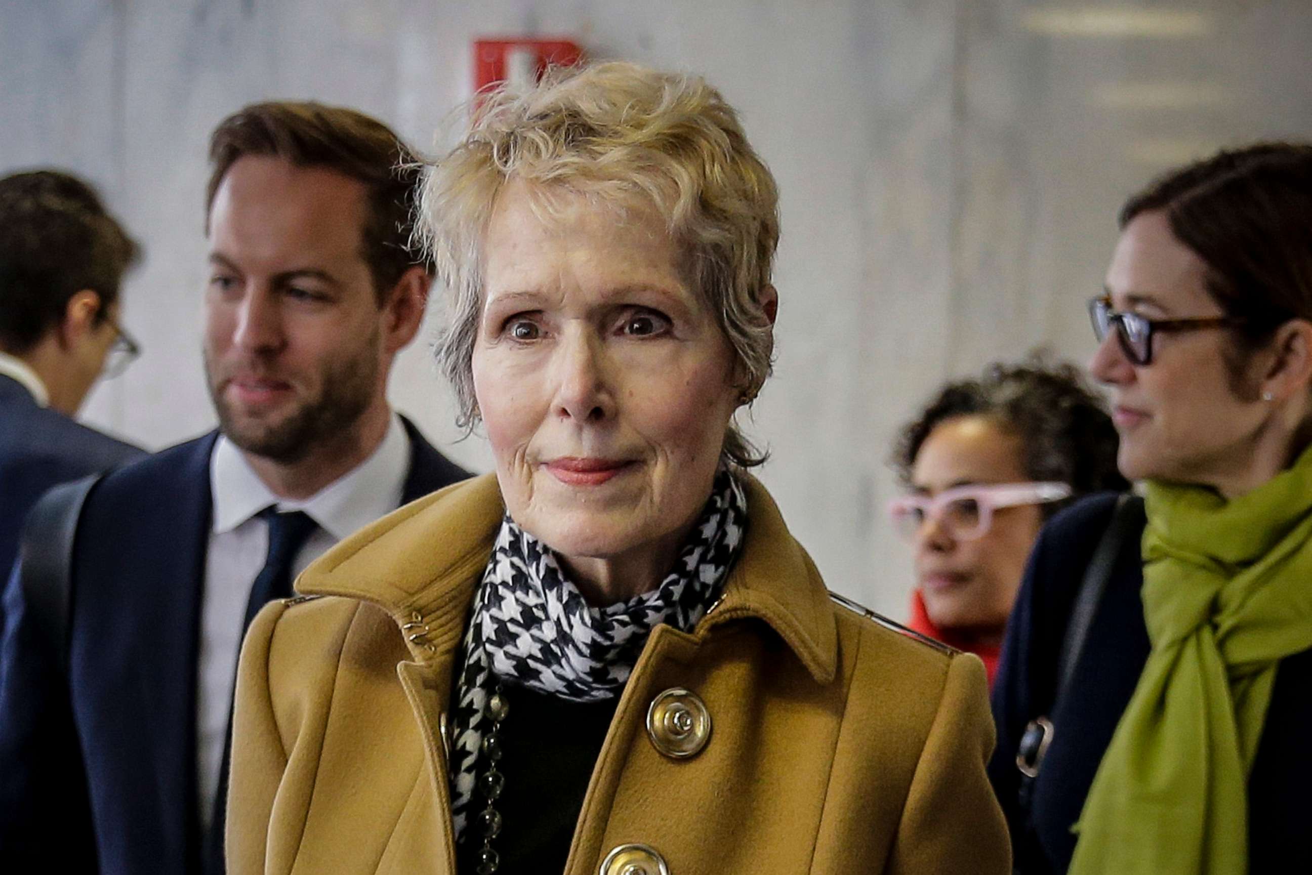 PHOTO: FILE - E. Jean Carroll, center, waits to enter a courtroom in New York for her defamation lawsuit against President Donald Trump, March 4, 2020.