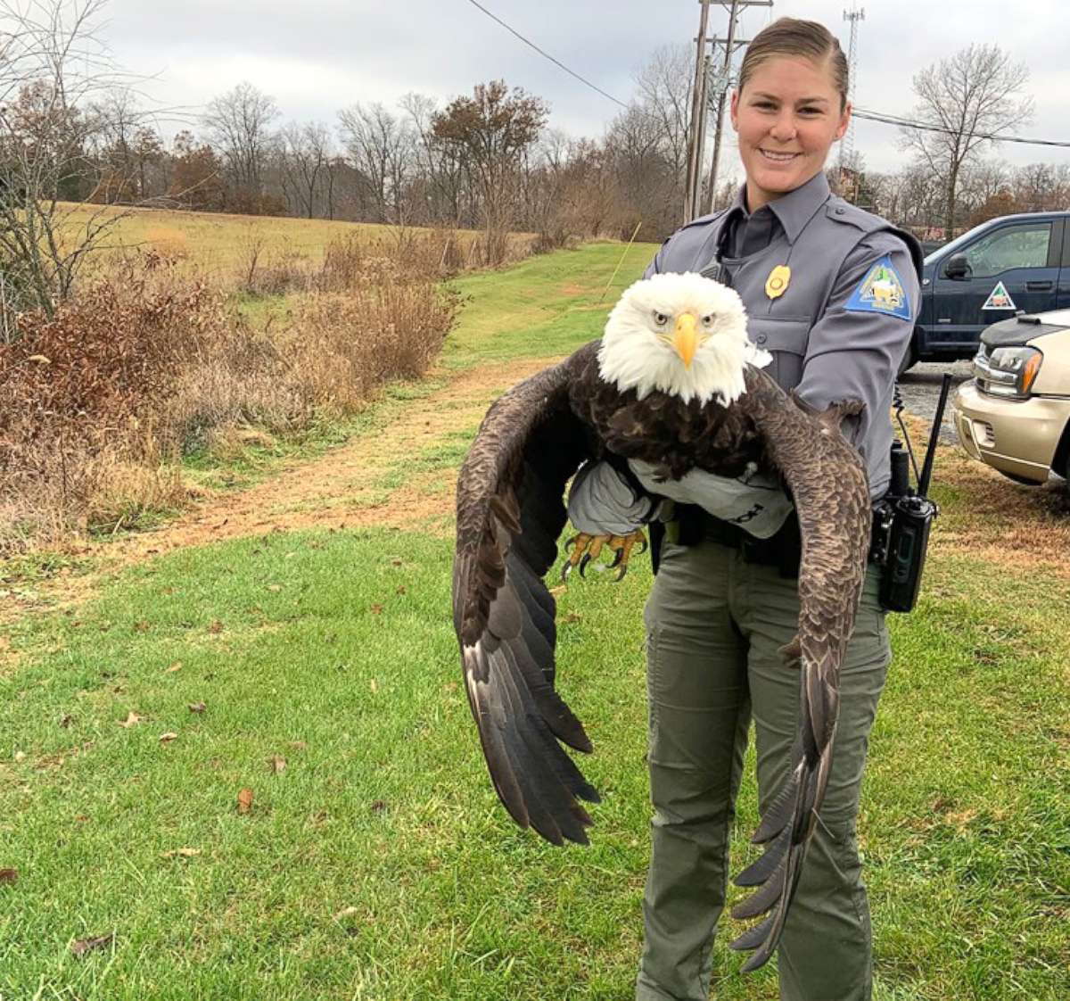 PHOTO: Missouri Department of Conservation Agent Haeley Eichler holds an adult female bald eagle that was rescued after it was shot twice in its wing near Paris, Missouri.
