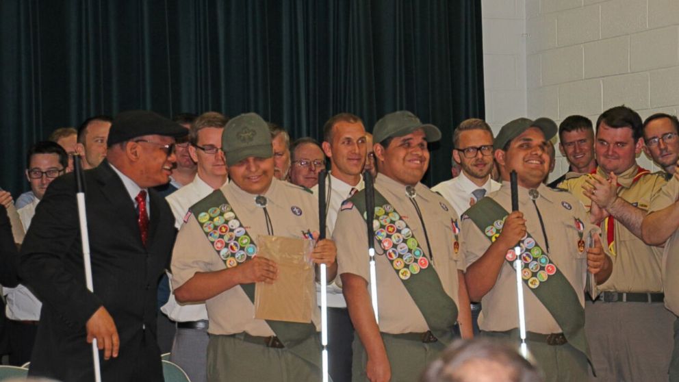 PHOTO: Nick, Leo and Steven Cantos are all smiles during their Boy Scouts badge ceremony. 