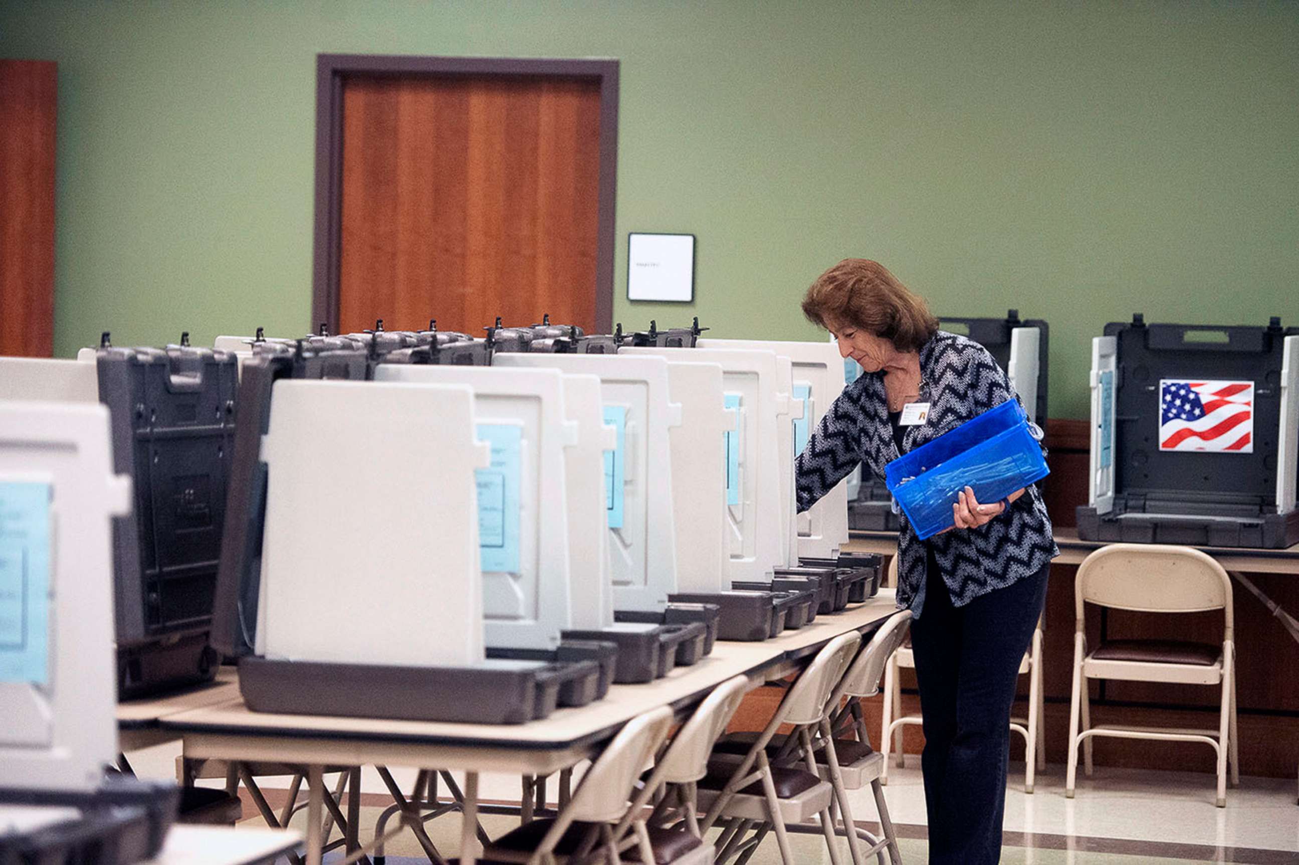 PHOTO: A County Elections Commission worker prepares voter booths ahead of early voting in Nacogdoches, Tx., Oct. 19, 2018
