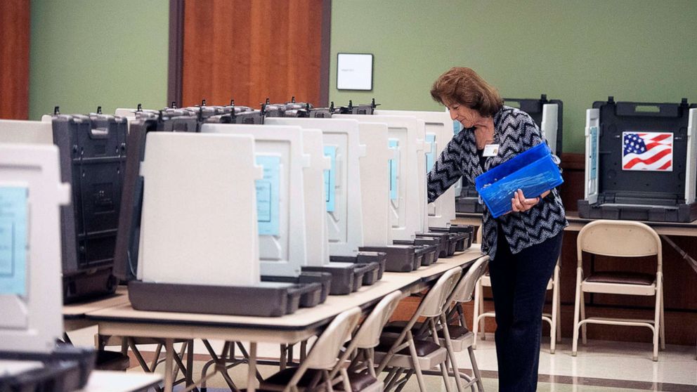 PHOTO: A County Elections Commission worker prepares voter booths ahead of early voting in Nacogdoches, Tx., Oct. 19, 2018