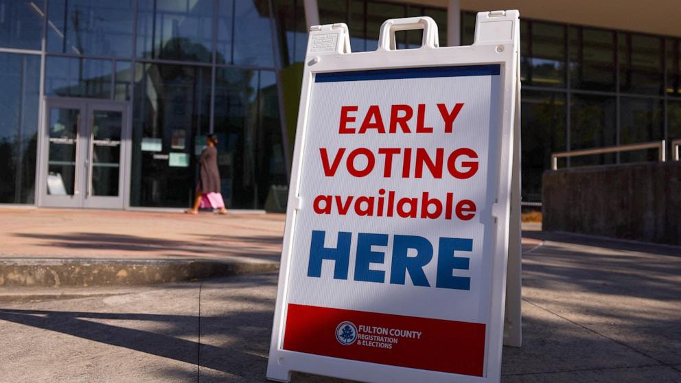 PHOTO: A sign sits outside of a polling location as the battleground state opened for early voting, in Atlanta, Georgia, October 23, 2024.