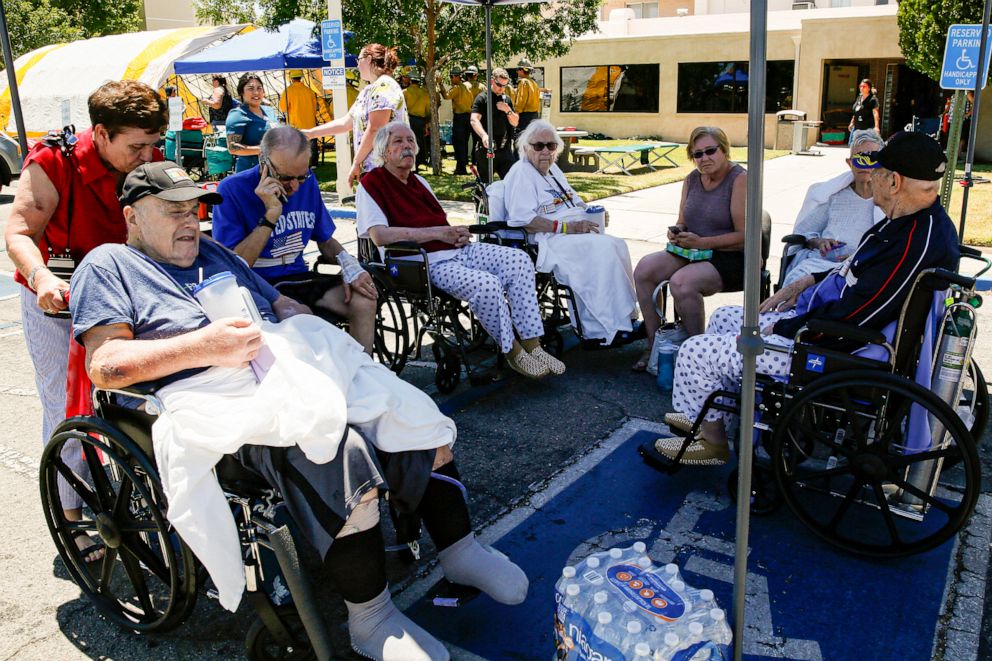 PHOTO: Evacuated patients rest under a shade of tent after being evacuated from Ridgecrest Regional Hospital after city was hit by a 6.4 earthquake July 04, 2019, in Ridgecrest, Calif. 