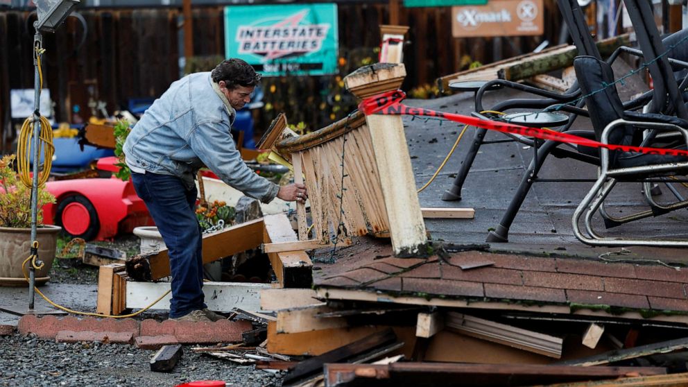 PHOTO: Homeowner Darren Gallagher inspects the collapsed second story porch of his house after a strong 6.4-magnitude earthquake struck off the coast of Northern California, in Rio Dell, Calif., Dec. 20, 2022.