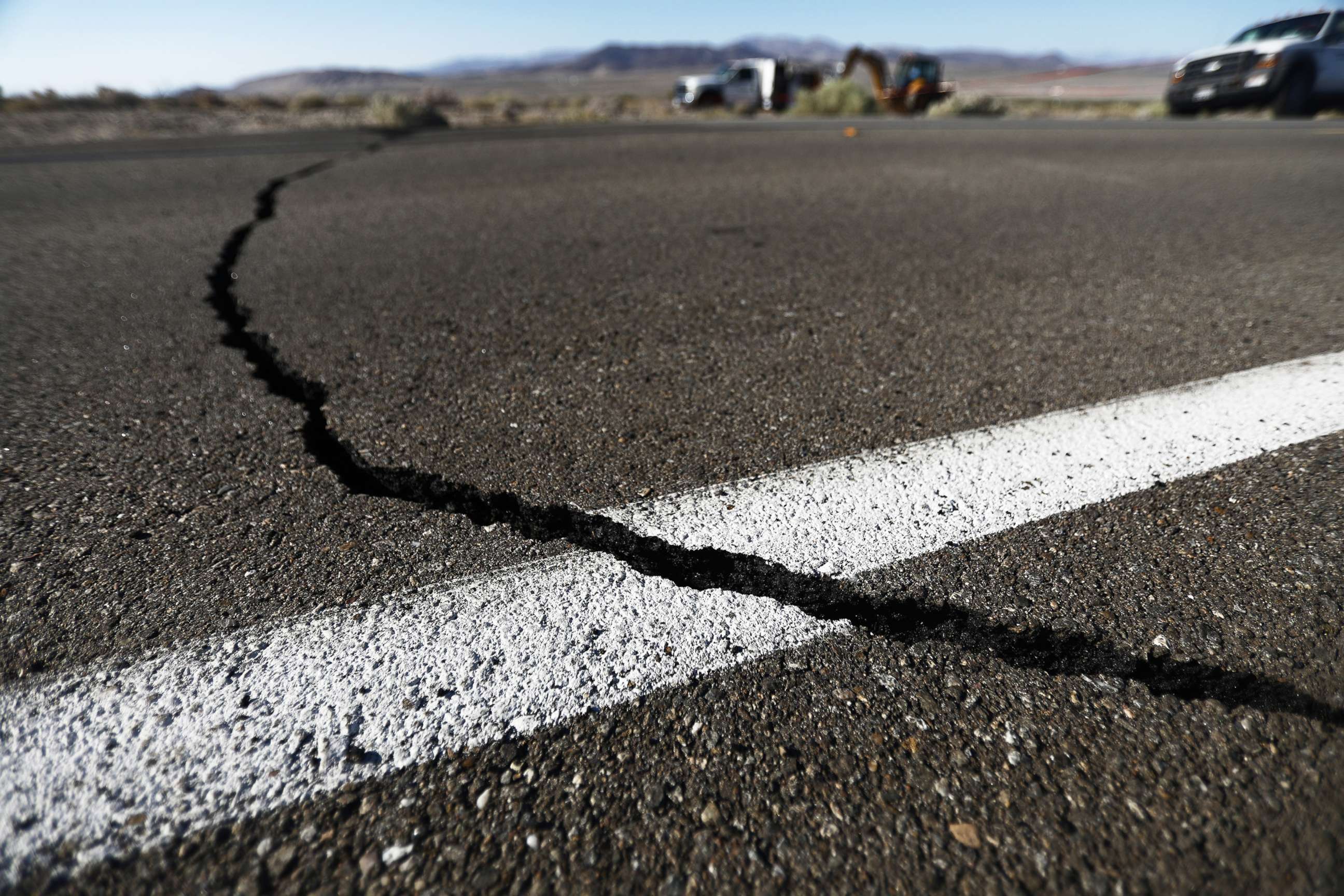 PHOTO: A crack stretches across the road after a 6.4 magnitude earthquake struck the area on July 4, 2019, near Ridgecrest, Calif.