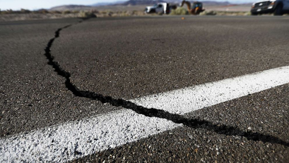 PHOTO: A crack stretches across the road after a 6.4 magnitude earthquake struck the area on July 4, 2019, near Ridgecrest, Calif.