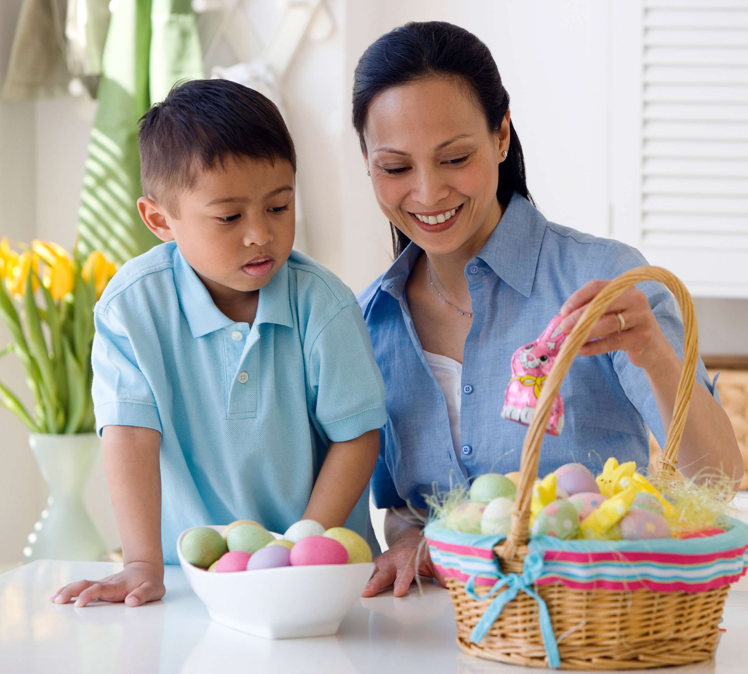 PHOTO: A woman looks at an Easter basket with a small child in an undated stock photo.