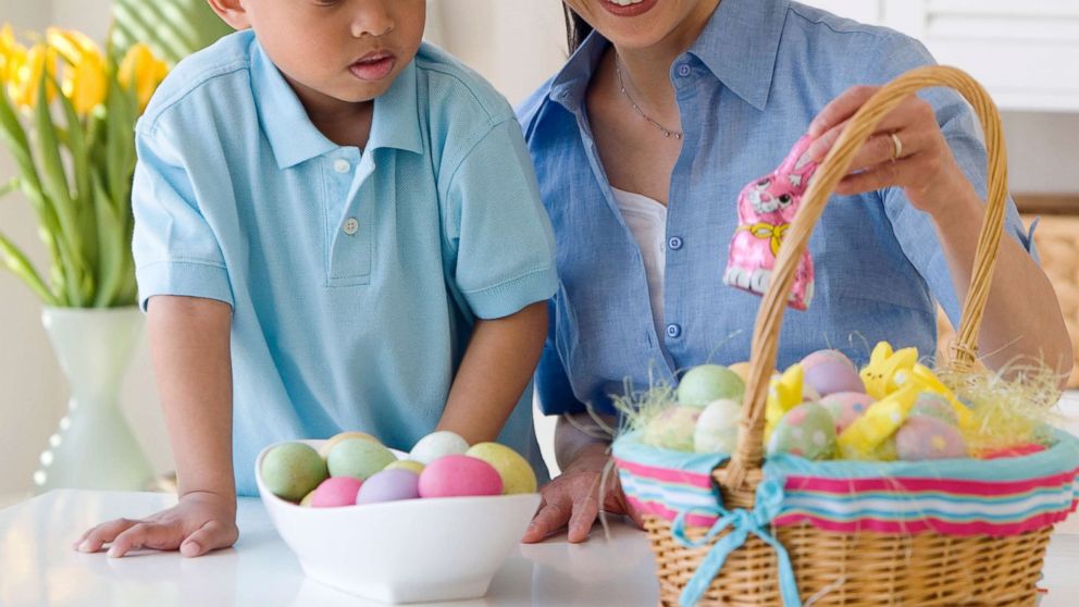 PHOTO: A woman looks at an Easter basket with a small child in an undated stock photo.