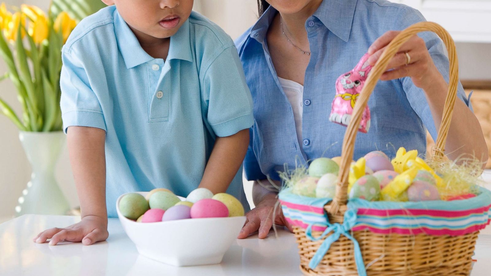 PHOTO: A woman looks at an Easter basket with a small child in an undated stock photo.