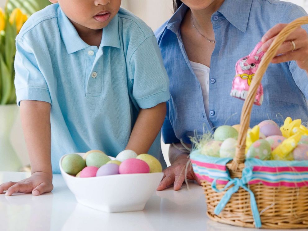 PHOTO: A woman looks at an Easter basket with a small child in an undated stock photo.
