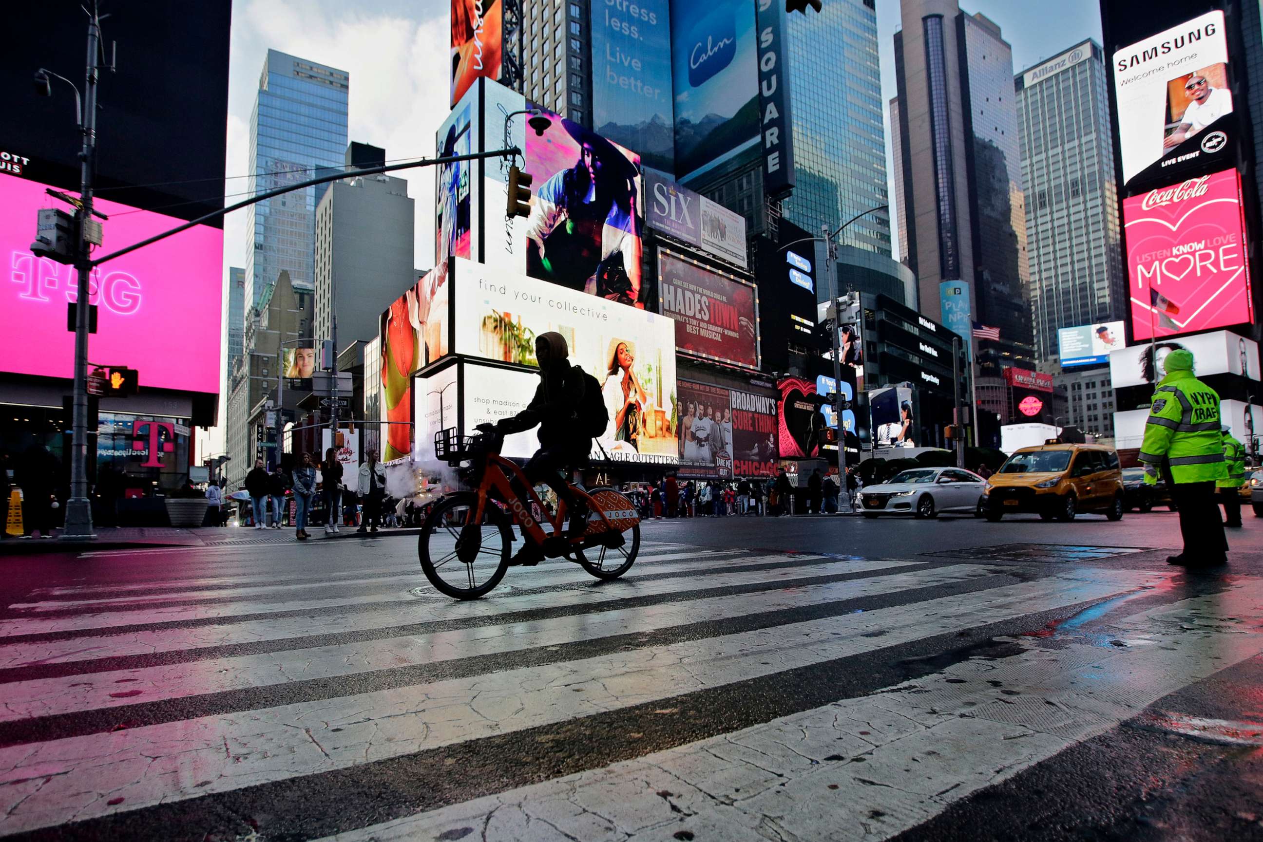 PHOTO: A man rides an e-bike through Times Square, Feb. 21, 2023, in New York.