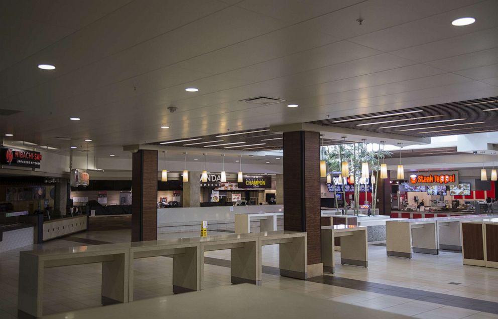 PHOTO: The food court at the Ala Moana Center stands empty in Honolulu, Hawaii, U.S., on Monday, May 11, 2020.