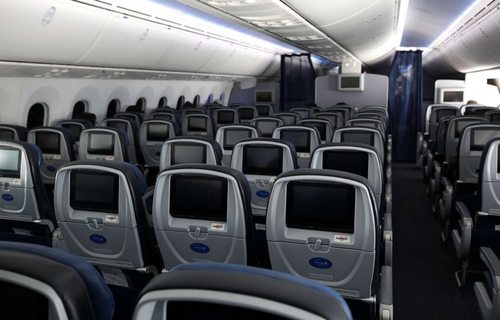 PHOTO: Many of the seats aboard a United Airlines flight sit empty on May 11, 2020 in flight to Houston, Texas from San Francisco.