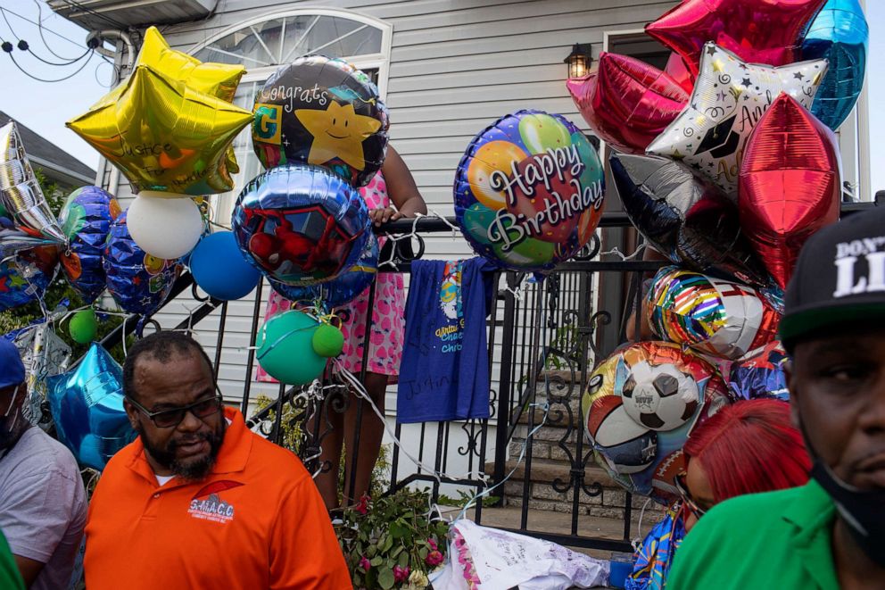 PHOTO: Activists hold a memorial vigil for ten-year-old Justin Wallace outside the home where he was shot to death, June 9, 2021, in the Edgemere neighborhood of Far Rockaway, Queens, New York.