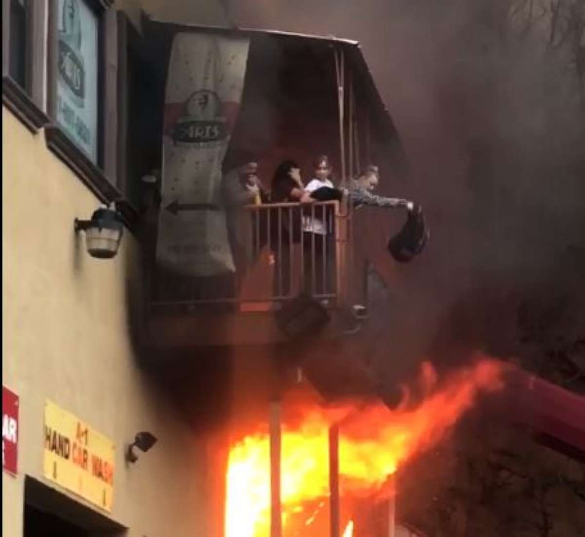 Members of a dance studio in Edgewater, N.J., were forced to flee from the second floor after the building went up in flames, Monday, April 9, 2018.