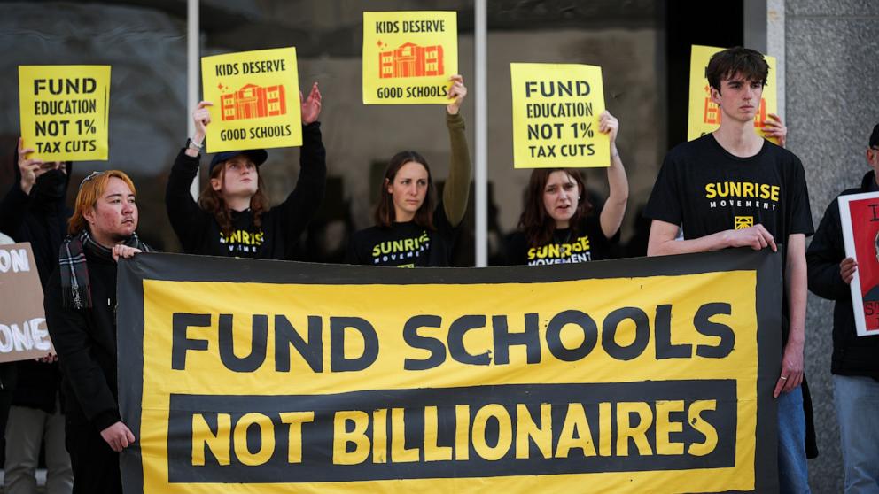 PHOTO: Community members rally in front of the Department of Education to protest budget cuts, Mar. 13, 2025 in Washington.