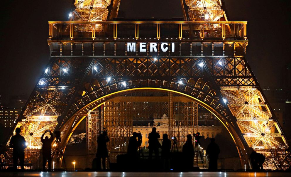 PHOTO: The message "Merci" thanking those on the frontlines in fight against the coronavirus pandemic, is lit up on the facade of the Eiffel Tower, in Paris, March 27, 2020.