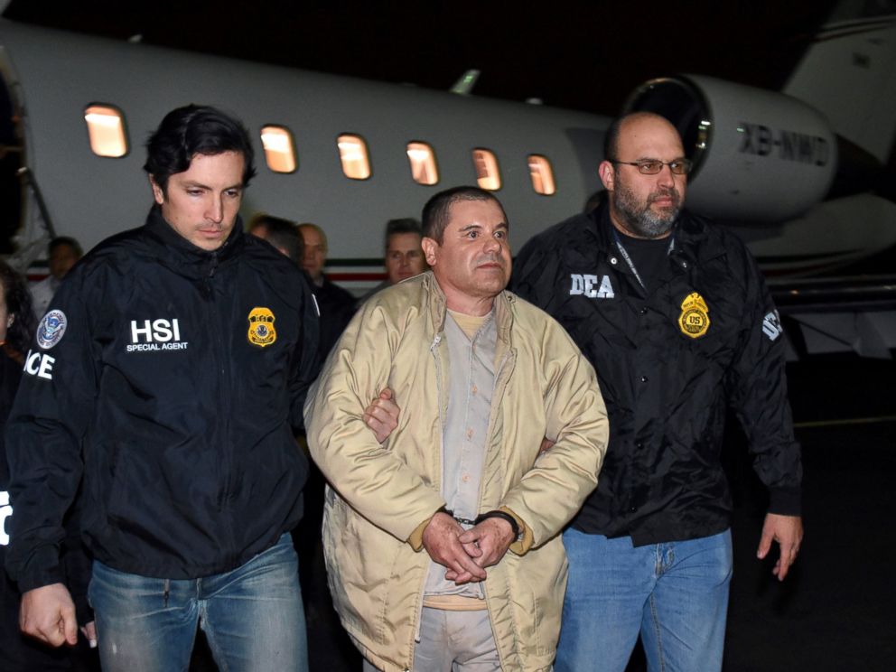 PHOTO: In this Jan. 19, 2017 file photo provided U.S. law enforcement, authorities escort Joaquin El Chapo Guzman, center, from a plane to a waiting caravan of SUVs at Long Island MacArthur Airport, in Ronkonkoma, N.Y.