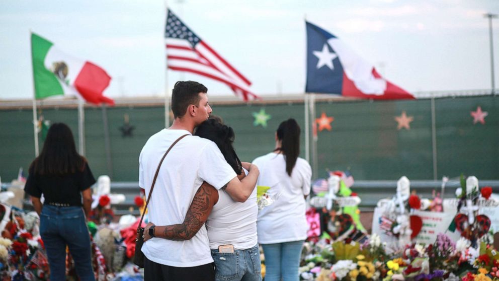 PHOTO: People gather at a makeshift memorial honoring victims outside of Walmart, Aug. 15, 2019, in El Paso, Texas.