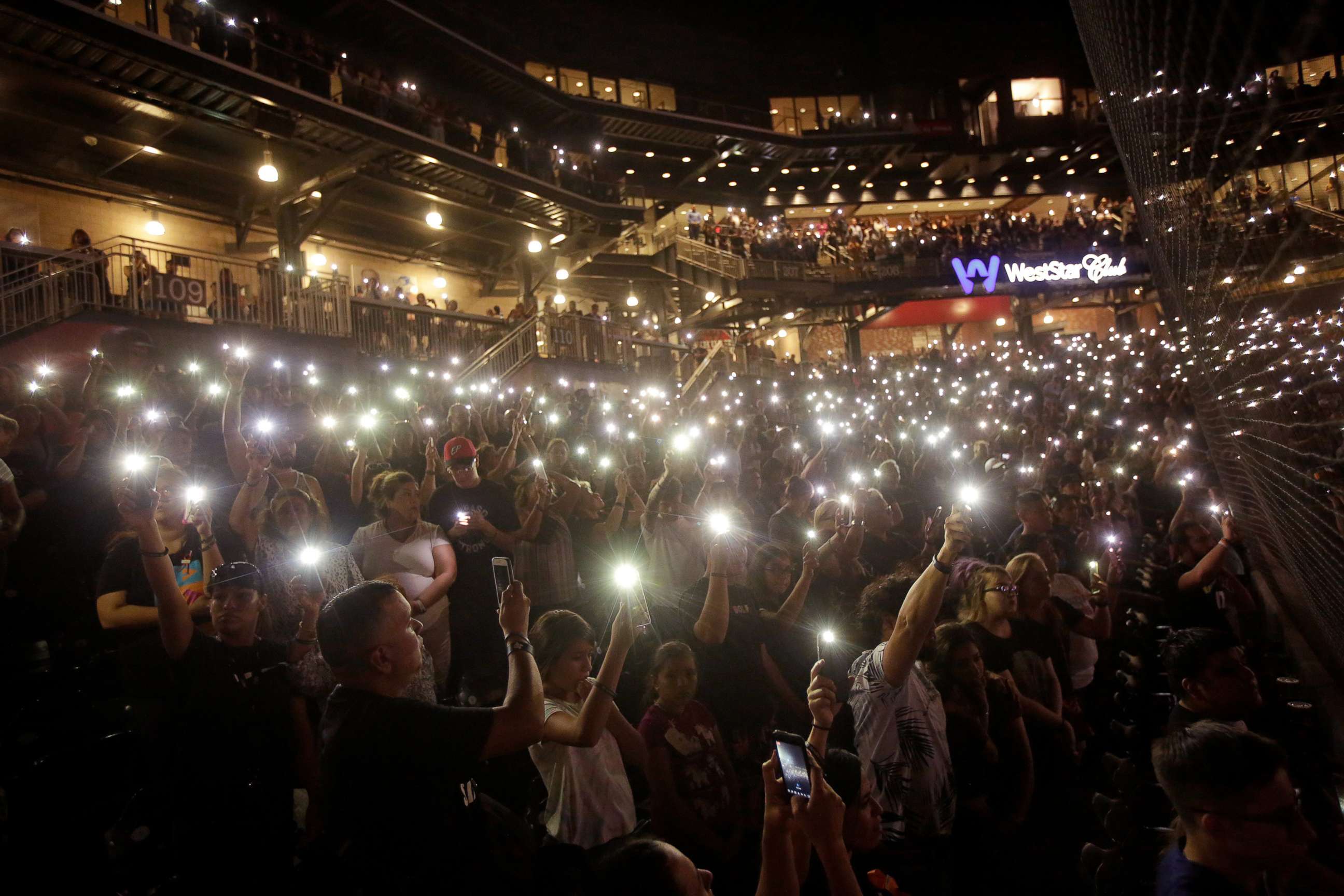 PHOTO: People take part in a memorial at Southwest University Park for the victims of a shooting at a Walmart store in El Paso, Texas, Aug. 14, 2019.