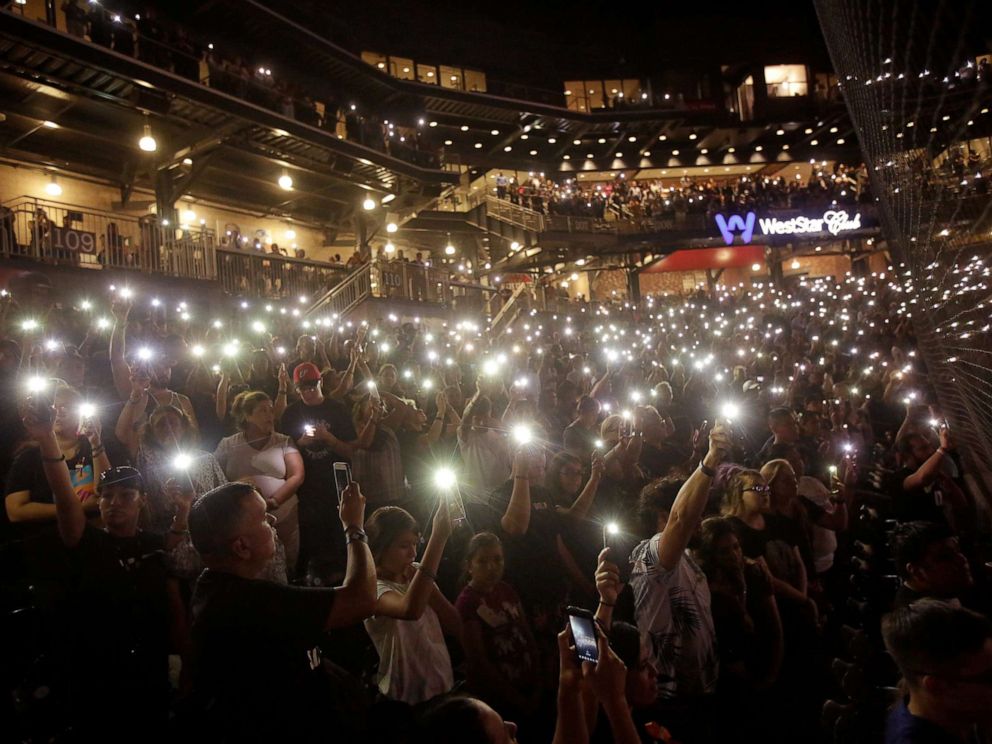 PHOTO: People take part in a memorial at Southwest University Park for the victims of a shooting at a Walmart store in El Paso, Texas, Aug. 14, 2019.