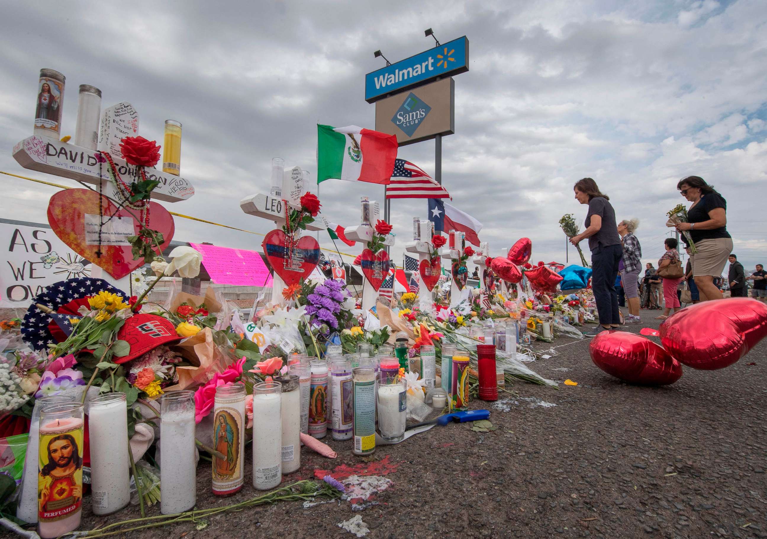 PHOTO: People leave flowers at a makeshift memorial for shooting victims at the  Cielo Vista Mall Walmart, in El Paso, Texas, August 6, 2019.