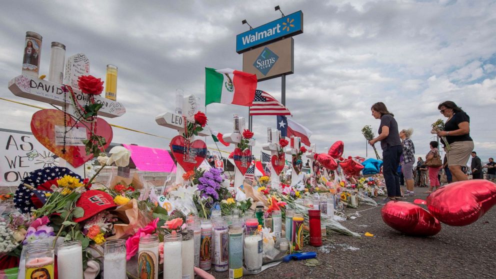 PHOTO: People leave flowers at a makeshift memorial for shooting victims at the  Cielo Vista Mall Walmart, in El Paso, Texas, August 6, 2019.