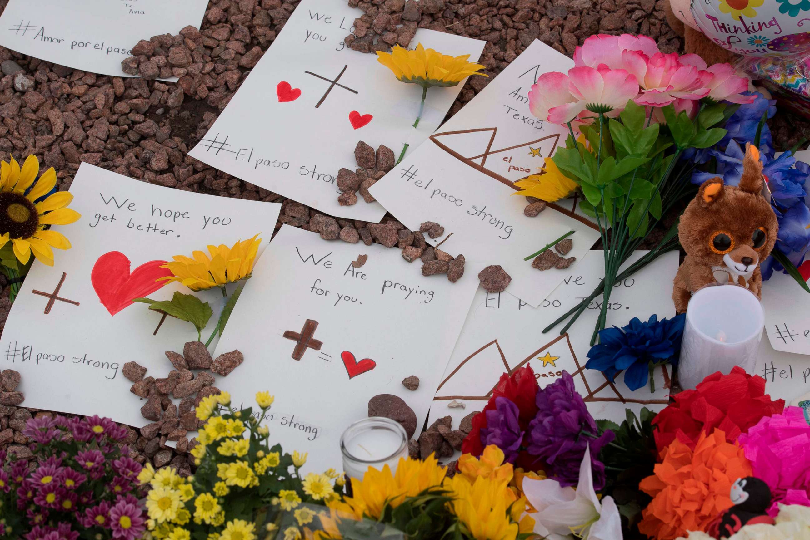 PHOTO: Messages and flowers at a makeshift memorial outside the Cielo Vista Mall Wal-Mart, Aug. 4, 2019, where a shooting left 20 people dead in El Paso, Texas.
