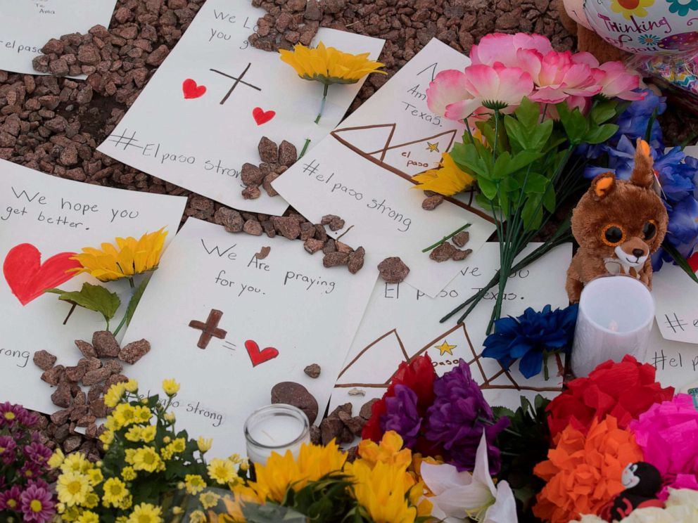 PHOTO: Messages and flowers at a makeshift memorial outside the Cielo Vista Mall Wal-Mart, Aug. 4, 2019, where a shooting left 20 people dead in El Paso, Texas.