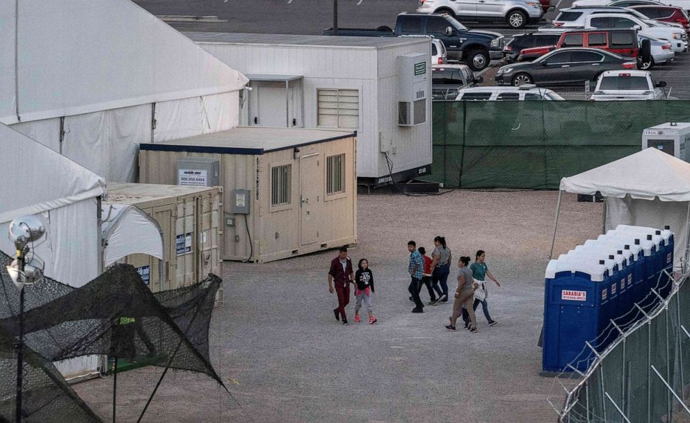 PHOTO: Immigrants held in a temporary facility set up to hold them at the El Paso Border Patrol Station, June 21, 2019.