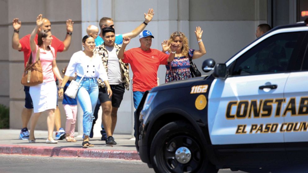 PHOTO: Shoppers exit after a mass shooting at a Walmart in El Paso, Texas, Aug. 3, 2019.