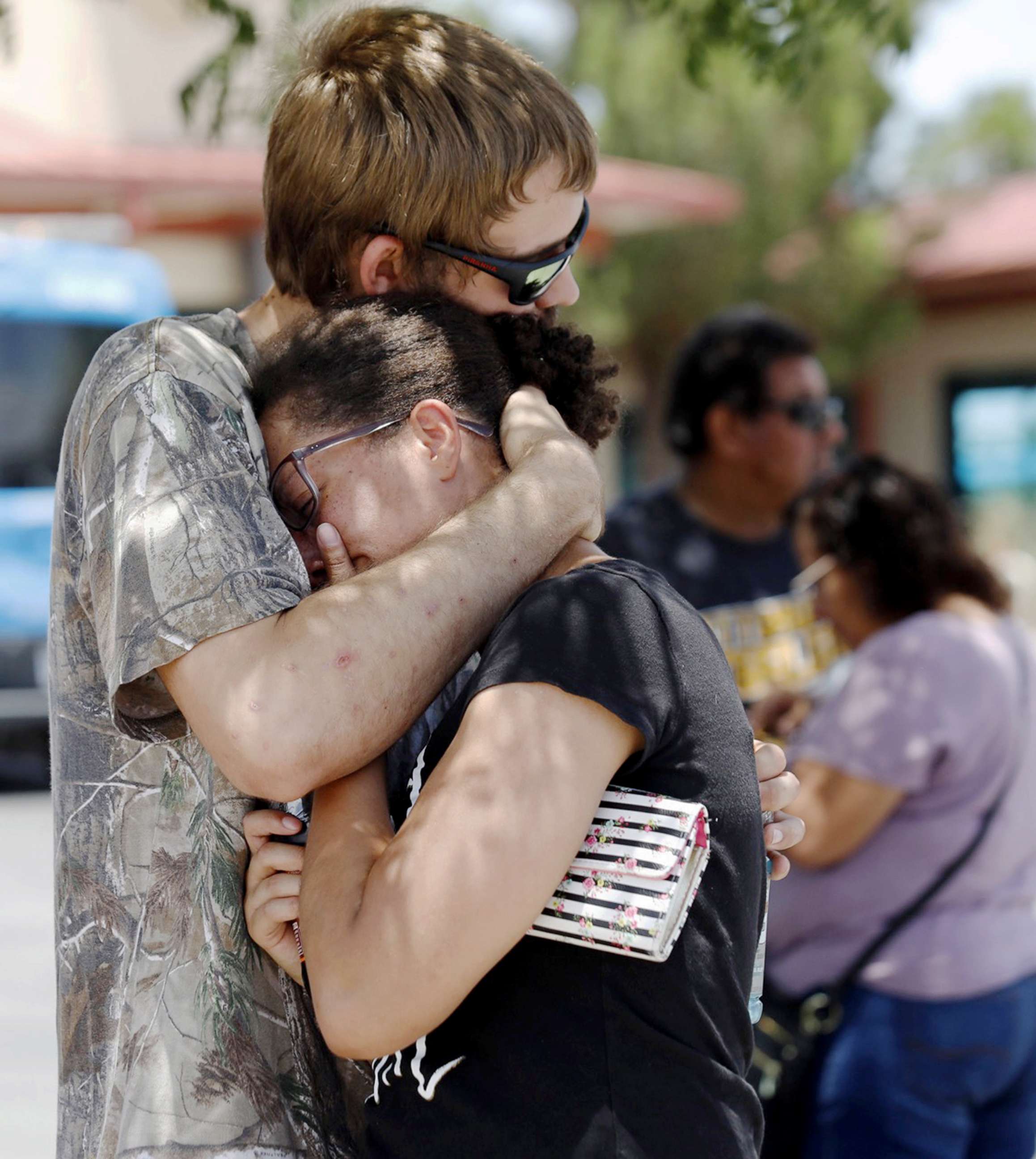 PHOTO:A man comforts a woman who was in the freezer section of a Walmart during a shooting incident, in El Paso, Texas, Aug. 03, 2019.