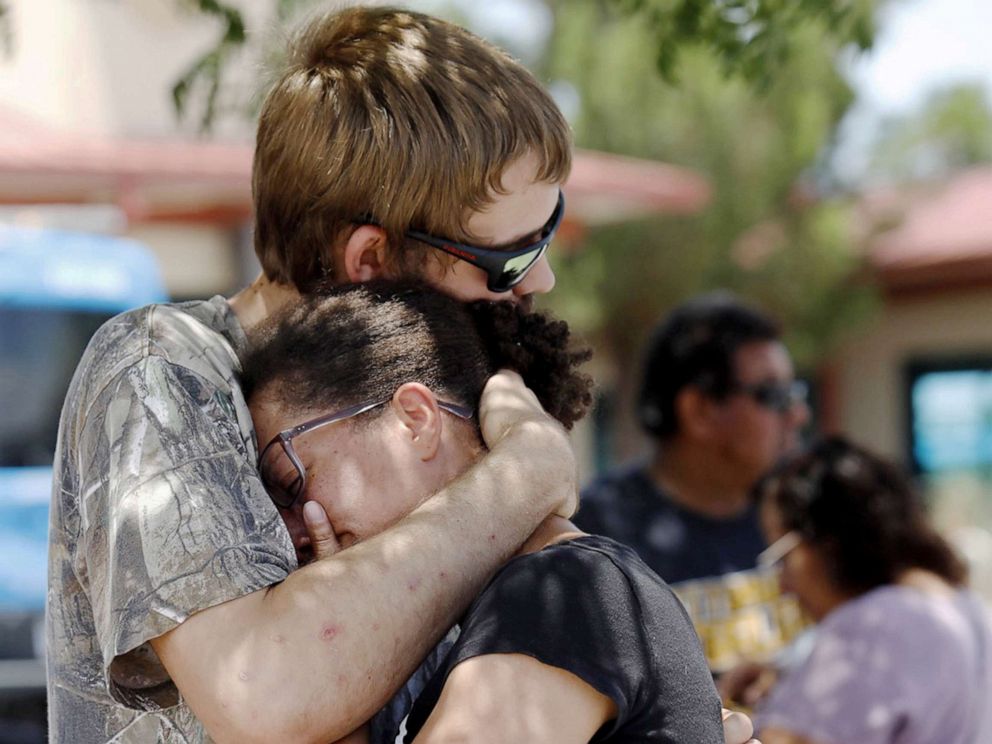 PHOTO:A man comforts a girl who used to be within the freezer piece of a Walmart in some unspecified time in the future of a capturing incident, in El Paso, Texas, Aug. 03, 2019.