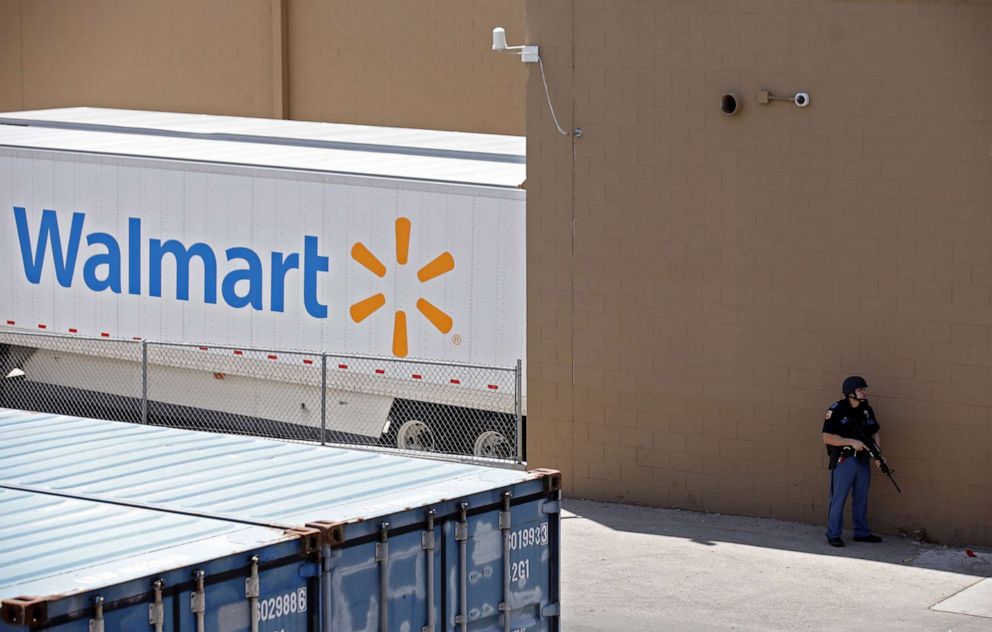 PHOTO: A police officer stands at attention during a mass shooting at a Walmart in El Paso, Texas, August 3, 2019.