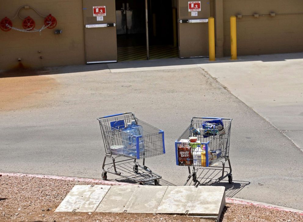 PHOTO: Shopping carts sit next to a curb after a shooting at a Walmart in El Paso, Texas, Aug. 3, 2019.