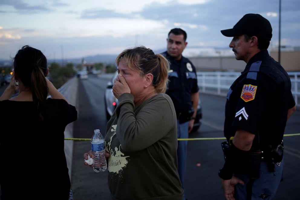 PHOTO: A woman reacts while trying to find her mother after a mass shooting at a Walmart in El Paso, Texas, Aug. 3, 2019.