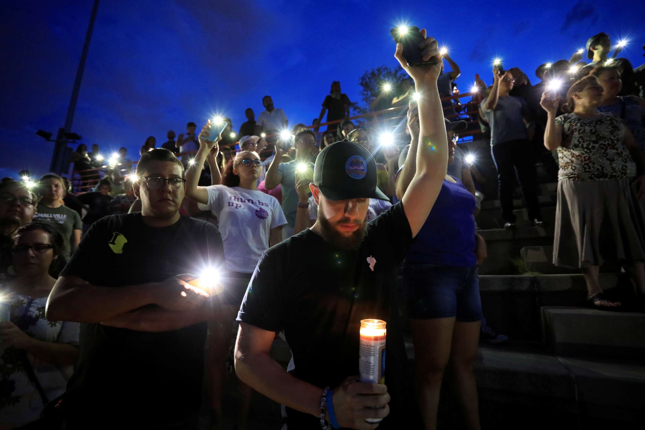 PHOTO: Francisco Castaneda joins mourners taking part in a vigil at El Paso High School after a mass shooting at a Walmart store in El Paso, Texas, U.S. August 3, 2019. REUTERS/Jorge Salgado NO RESALES. NO ARCHIVES.