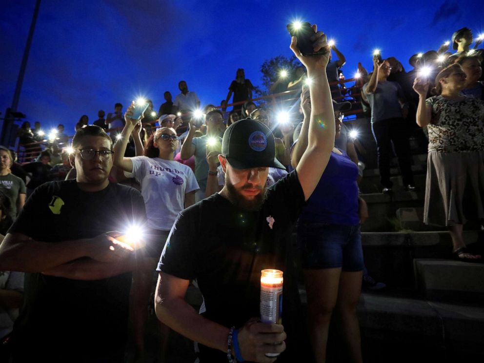 PHOTO: Francisco Castaneda joins mourners taking part in a vigil at El Paso High School after a mass shooting at a Walmart store in El Paso, Texas, U.S. August 3, 2019. REUTERS/Jorge Salgado NO RESALES. NO ARCHIVES.