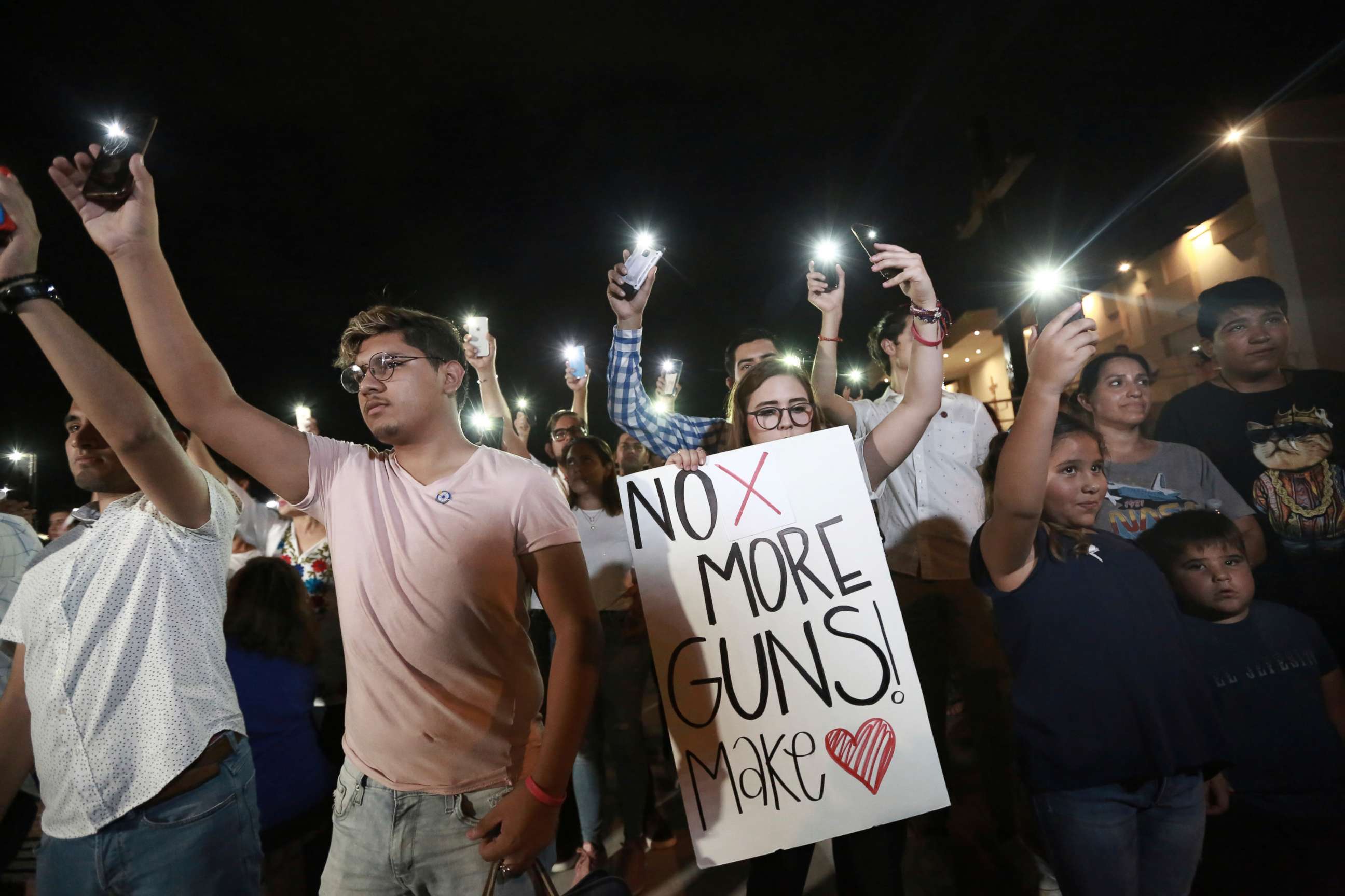 PHOTO: People gather in Juarez, Mexico, Aug. 3, 2019, to participate in a vigil for the 3 Mexican nationals who were killed in an El Paso, Texas shopping-complex shooting.