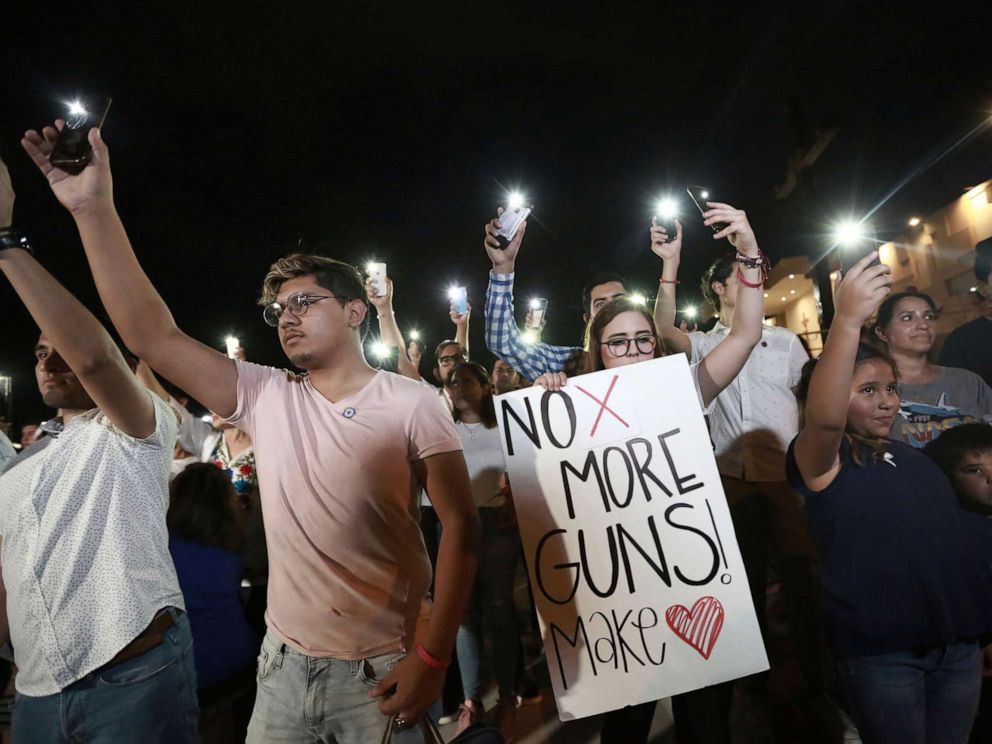 PHOTO: People gather in Juarez, Mexico, Aug. 3, 2019, to participate in a vigil for the 3 Mexican nationals who were killed in an El Paso, Texas shopping-complex shooting.