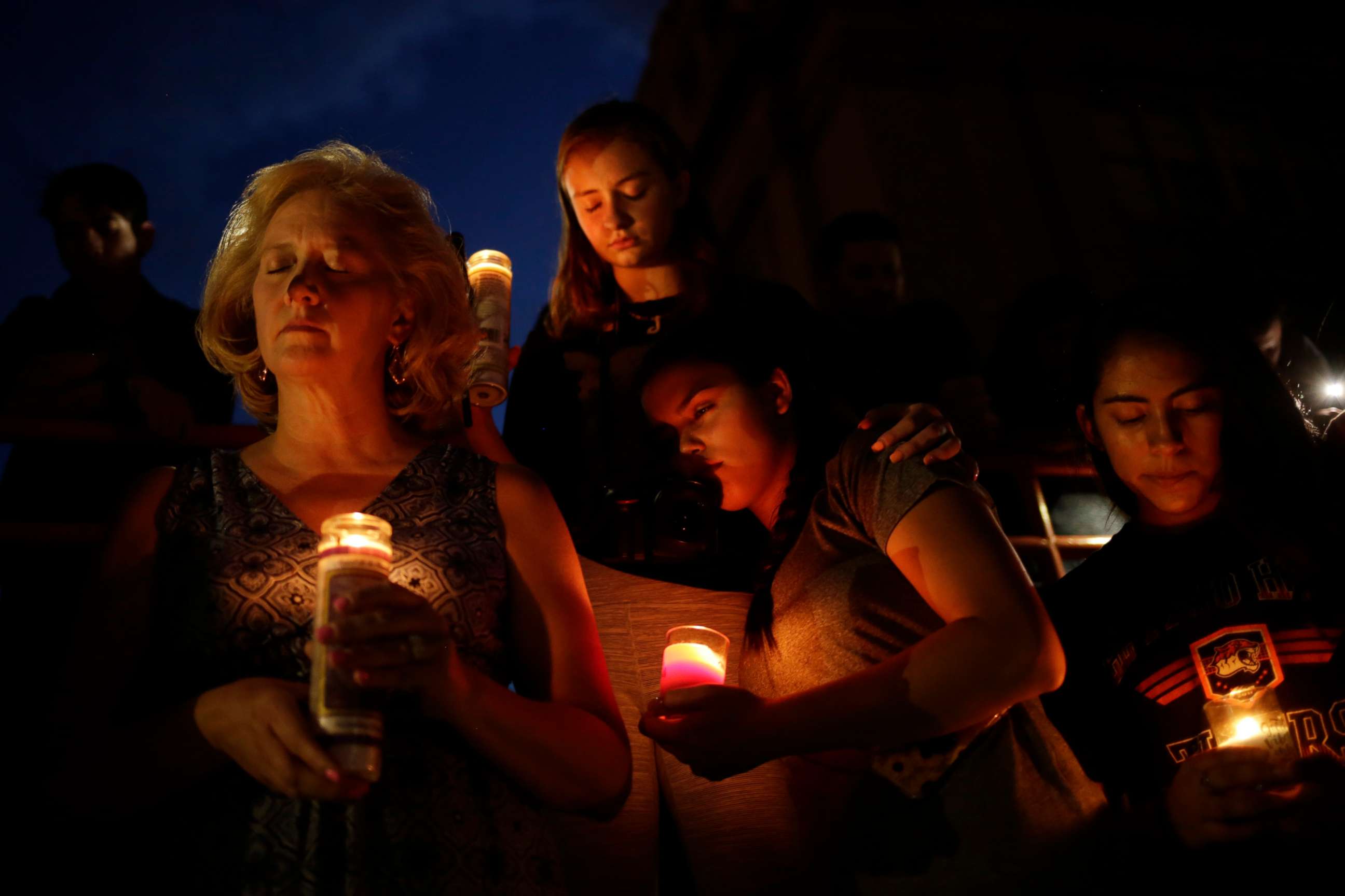 PHOTO: Mourners take part in a vigil at El Paso High School after a mass shooting at a Walmart store in El Paso, Texas, Aug. 3, 2019.
