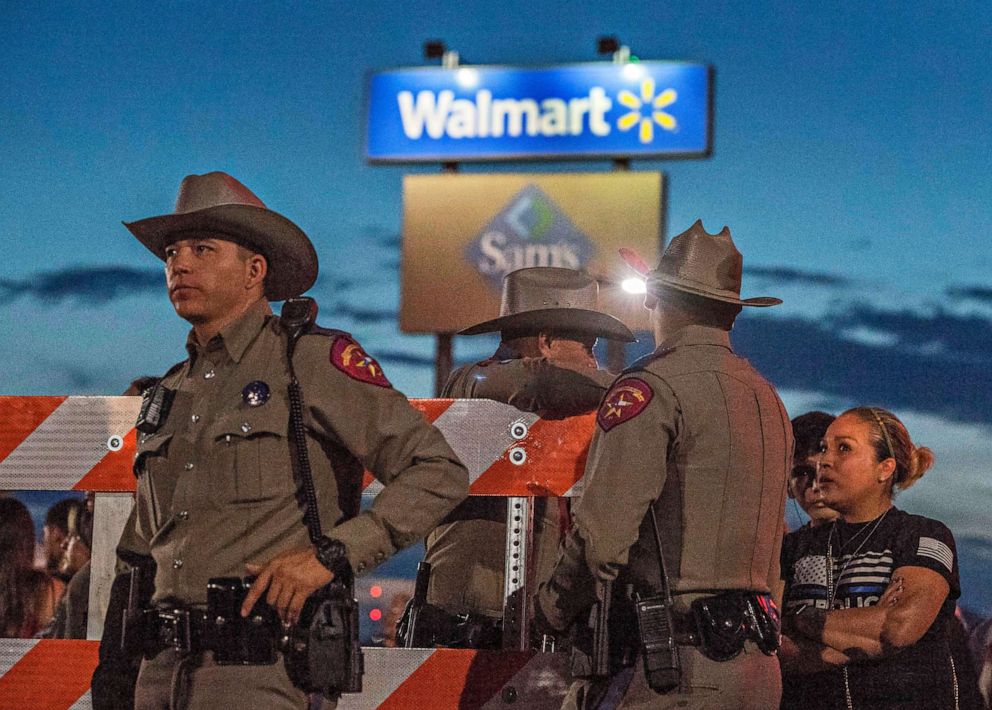 PHOTO: Texas State Troopers keep watch, Aug. 6, 2019, at the makeshift memorial for victims of the shooting that left a total of 22 people dead on Aug. 3 at the Cielo Vista Mall WalMart in El Paso, Texas.