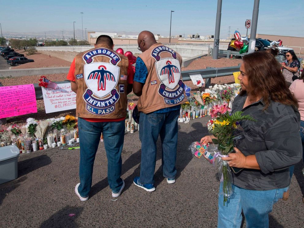 PHOTO: People pray at a makeshift memorial after the shooting that left at least 22 people dead at the Cielo Vista Mall WalMart in El Paso, Texas, Aug. 5, 2019.